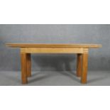 A contemporary birch extending dining table, with a rectangular top on square section legs. H.75 W.