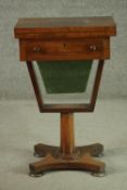 A Victorian rosewood games and sewing table, the rectangular fold out top with inlaid chess and