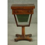 A Victorian rosewood games and sewing table, the rectangular fold out top with inlaid chess and