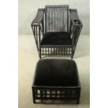 A black rattan garden chair and foot stool, of woven construction, the chair, with an adjustable