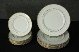 A set of eight Royal Doulton dinner plates and the matching side plates. Dia. 27 (largest)