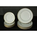 A set of eight Royal Doulton dinner plates and the matching side plates. Dia. 27 (largest)