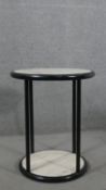 A contemporary circular occasional table, with a white marble top and undertier on an ebonised