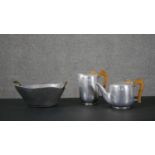 A David Marshall twin handled steel and brass twin handled fruit bowl along with a Picquot Ware