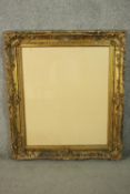 A 19th century gilt wood and gesso glazed frame. H.98 W.85cm.