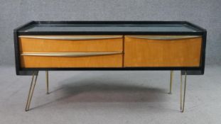 A circa 1950s black lacquered and birch sideboard, with a rectangular top over two drawers and a