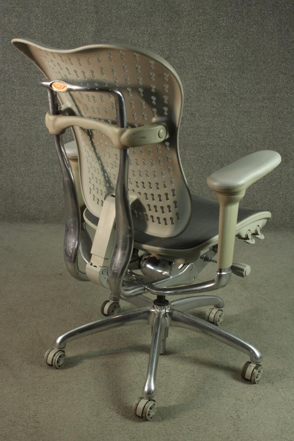 A Formway style office chair, in grey, with a pierced back, and adjustable arms, on a five point - Image 4 of 9
