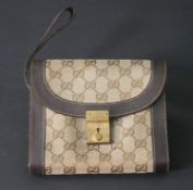 A vintage Gucci clutch handbag, marked Gucci, with dust bag and original key. H.16 W.19cm