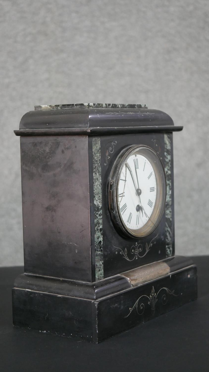 A Victorian black slate and green serpentine architectural mantle clock, adorned with a white - Image 6 of 7