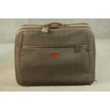 A Mulberry scotchgrain leather travelling case with wheels and spring loaded extending handle,