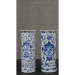 A near pair of Chinese blue and white porcelain vases, of cylindrical form with a flared rim, with