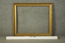 A gilt wood and gesso picture frame. H.68 W.78cm.