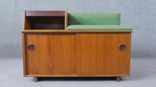 Chippy Heath, a 1960s teak telephone table and seat, with a telephone memory slide drawer and a