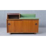 Chippy Heath, a 1960s teak telephone table and seat, with a telephone memory slide drawer and a