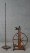 A 19th century spinning wheel in turned beech along with a wool spinners stand. H.178cm (largest)