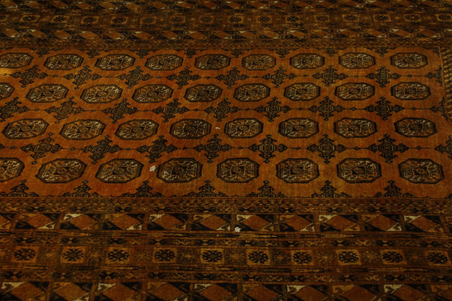 A gold ground hand made Afghan carpet. L.300 W.205cm - Image 2 of 6
