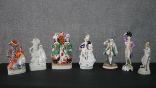 A collection of 19th century Staffordshire and Meissen style figures, including spill vases, a