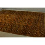 A gold ground hand made Afghan carpet. L.300 W.205cm