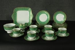 A vintage Wedgwood tea service to include six cups and saucers, matching plates etc, marked to