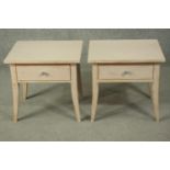 A pair of contemporary painted and distressed bedside tables, with a rectangular top over a single