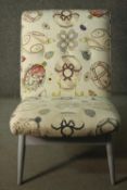 A Parker Knoll model No P.K. 945/7 Mk3 chair, upholstered in fabric with a Faberge egg style design,