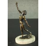 Gyula Maugsch (Hungarian, 1882-1946)- an Art Deco bronze female nude, holding a sphere aloft.