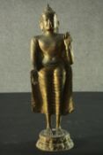 A brass Eastern standing Buddha figure. H.51cm.