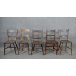 A harlequin set of five 19th century kitchen chairs, with bar backs, four with saddle seats on