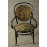 A late 19th/early 20th century Thonet style bentwood armchair, with circular foliate upholstered