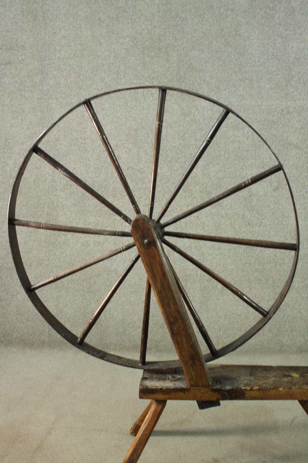 A rustic spinning wheel, possibly Welsh. H.146 W.124 D.43cm. (Wheel: 100cm) - Image 2 of 10