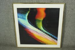 A framed and glazed colourful abstract print. H.70 W.67cm.