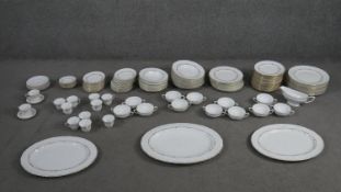 A Royal Worcester gold Chantilly pattern part twelve person dinner service. (133 pieces) Maker's