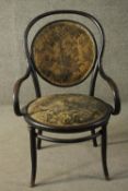 A late 19th/early 20th century Thonet style bentwood armchair, with circular foliate upholstered