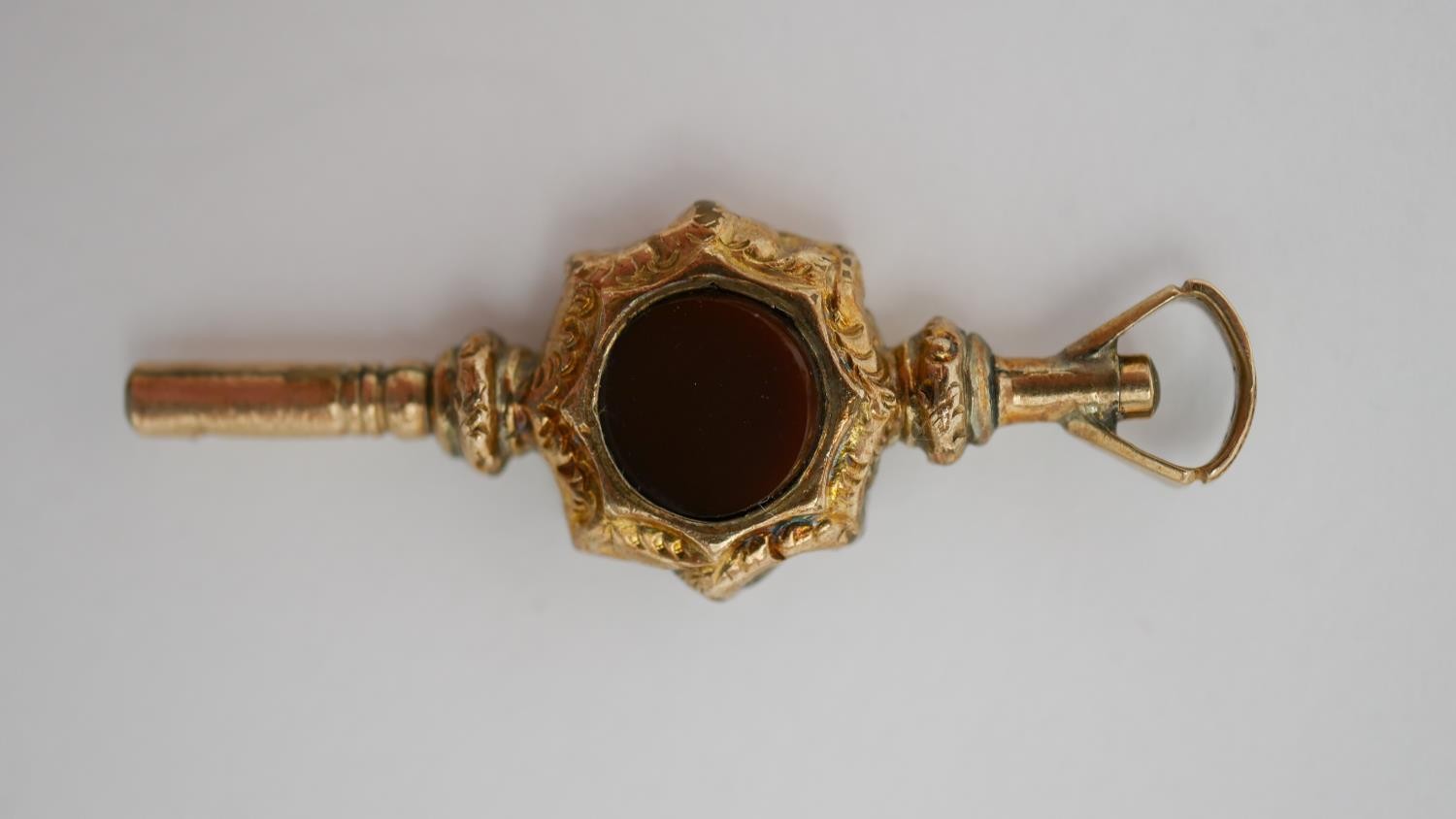 A Victorian 9 carat rose gold sardonyx and agate swivel fob along with an engraved gold plated watch - Image 4 of 13