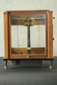 A Stanton Instruments Ltd cased set of precision laboratory scales, model CB6, teak cased, glazed to