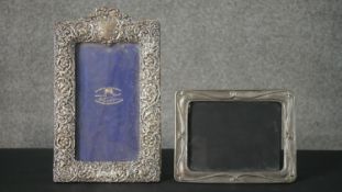 A Victorian silver repousse floral and foliate design easel photo frame with purple velvet