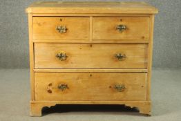 A Victorian pine chest of two short over three long graduated drawers, on shaped bracket feet. H,.83