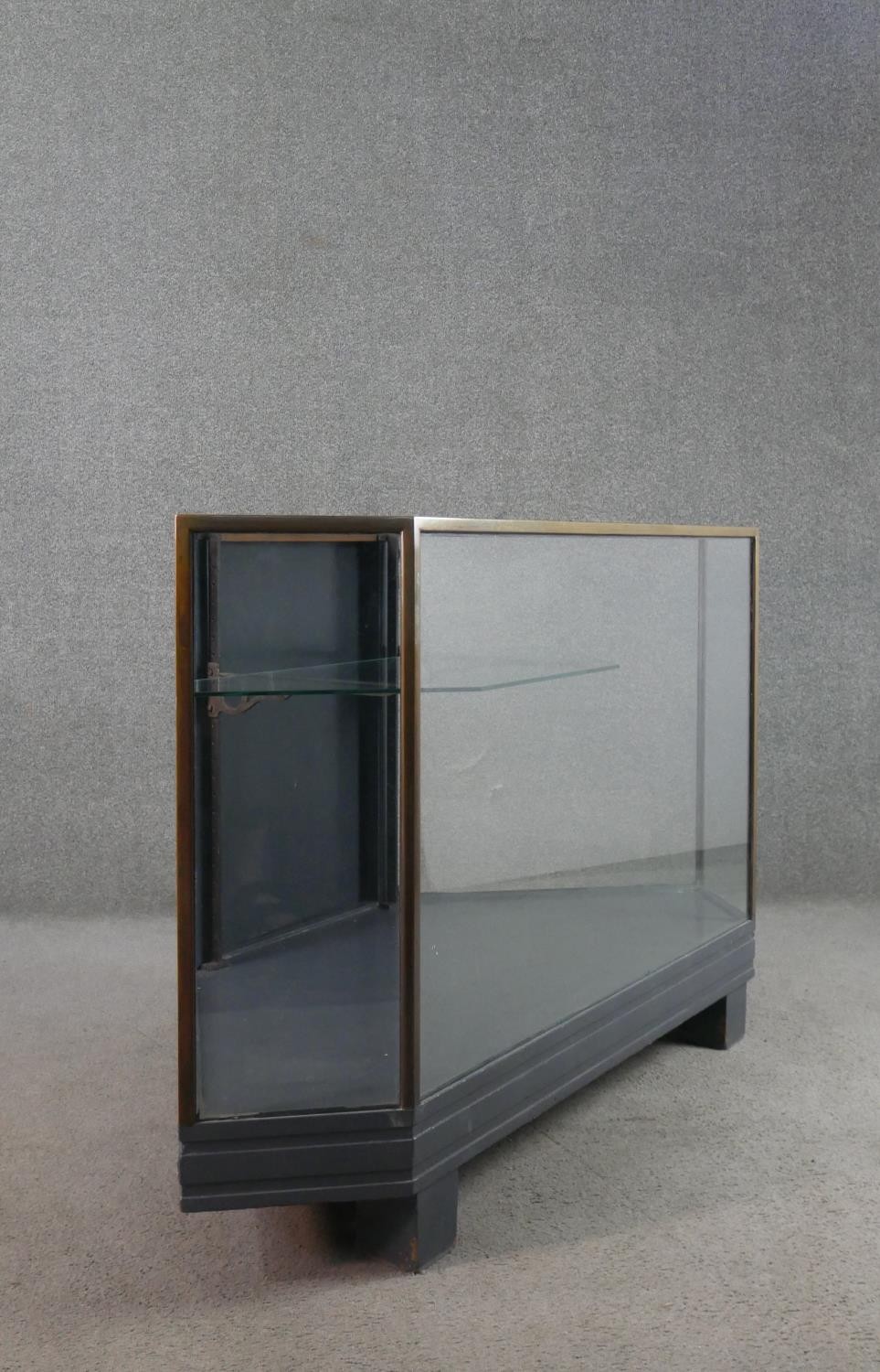 A mid 20th century shop corner display cabinet, glazed, with brass edges, enclosing a single - Image 5 of 7