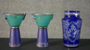 A pair of abstract design blue and turquoise art glass and ceramic goblets along with a cut to clear