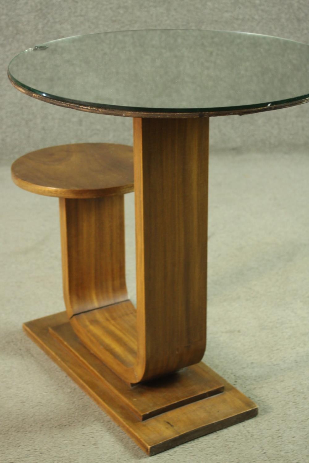 An Art Deco teak table and stool, with a circular glass table top, on a support which curves up to a - Image 7 of 8