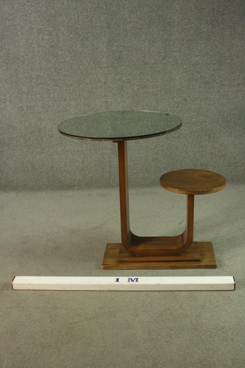 An Art Deco teak table and stool, with a circular glass table top, on a support which curves up to a - Image 2 of 8