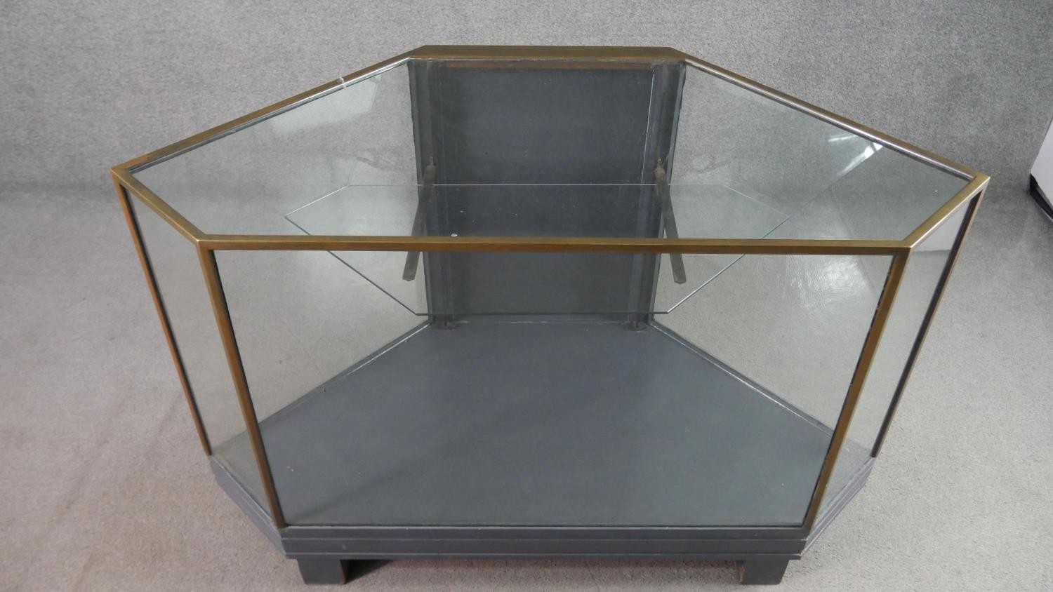 A mid 20th century shop corner display cabinet, glazed, with brass edges, enclosing a single - Image 3 of 7