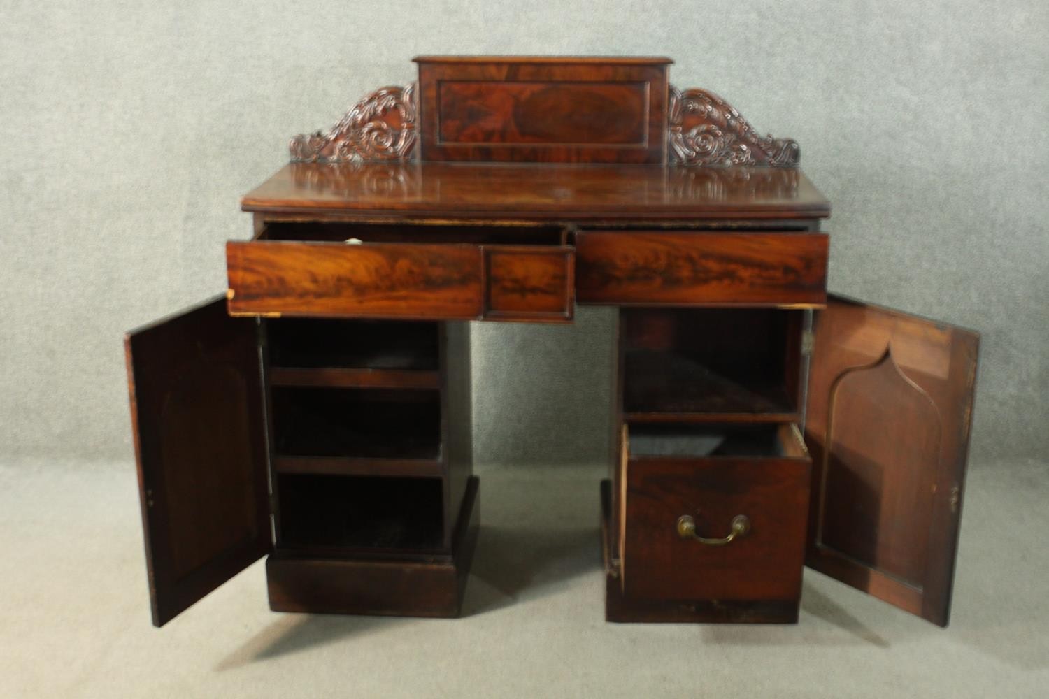 A William IV flame mahogany pedestal sideboard, the rectangular gallery back flanked by ornately - Image 6 of 10