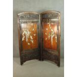 A Japanese Meiji period two fold screen, with rounded arch tops and a carved panel, over an elm