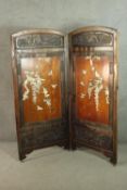 A Japanese Meiji period two fold screen, with rounded arch tops and a carved panel, over an elm