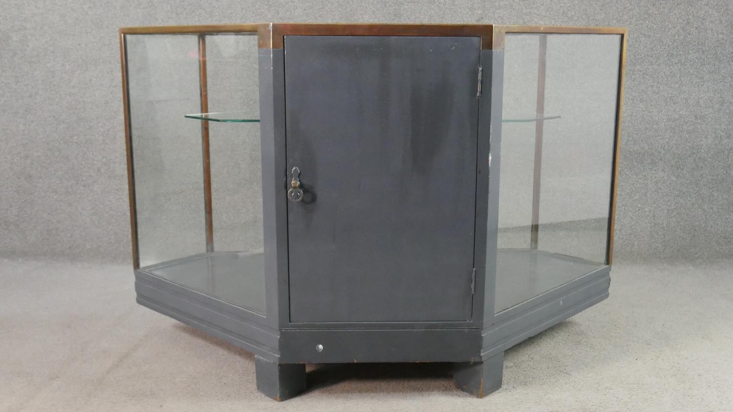 A mid 20th century shop corner display cabinet, glazed, with brass edges, enclosing a single - Image 6 of 7