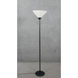 A black metal standard lamp with frosted glass conical shade. H.169 Diam.36cm