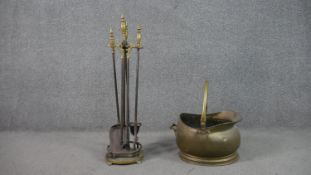 A Victorian brass and cast iron fire set along with a brass coal bucket with swing handle. H.75cm (