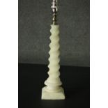 An alabaster table lamp, with a barley twist stem, on a square section base. H.42cm.