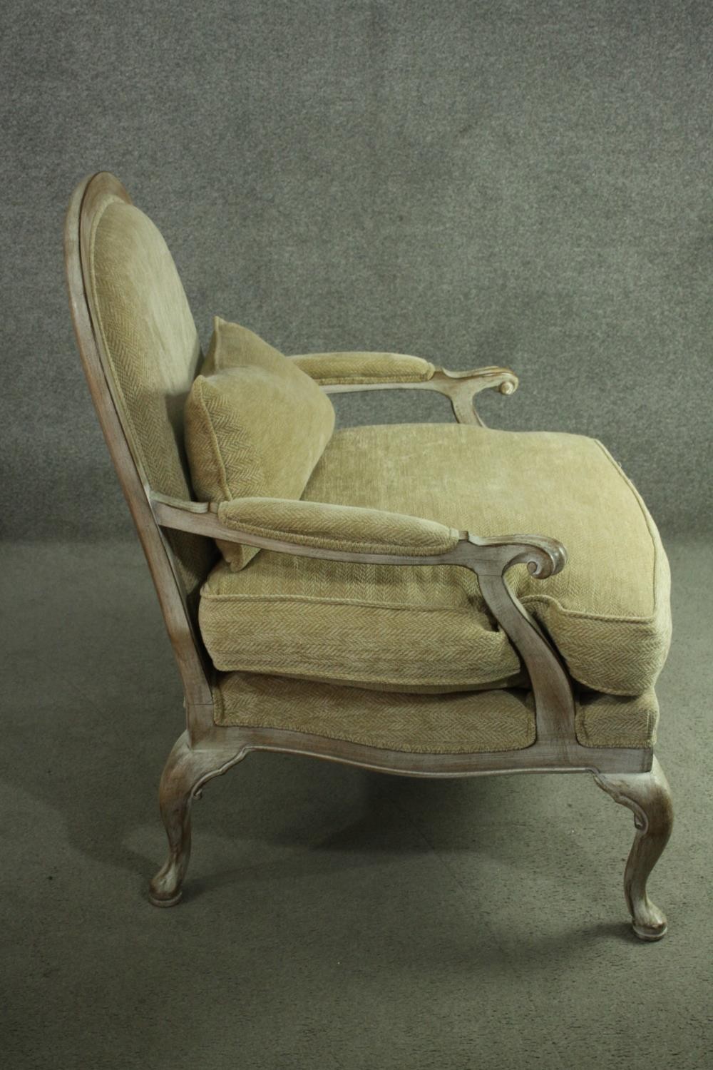 A Louis XV style limed oak fauteuil armchair, with a rounded back, upholstered to the back, arms and - Image 4 of 6